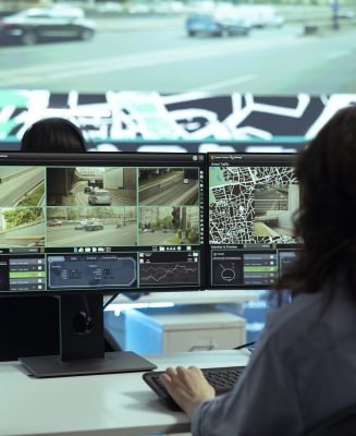 Call center employee providing shipment information via gps satellite navigation for their clients, ensuring fast delivery and order tracking service. Operator monitoring traffic for the couriers.